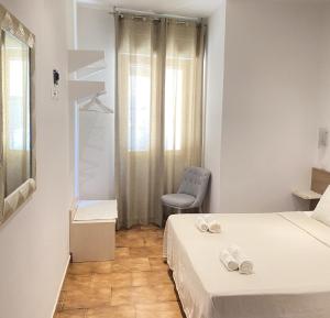 En eller flere senge i et værelse på Sunway Apartments