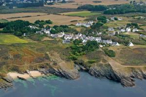 an aerial view of a small village on a rocky island at La Criste Marine in Groix