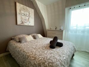 Posteľ alebo postele v izbe v ubytovaní Appart Cosy 2 chambres