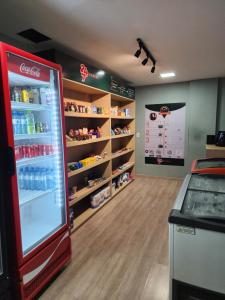 a store with a cocacola refrigerator in a room at Beira Mar Fortaleza Landscape in Fortaleza