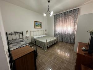 Postel nebo postele na pokoji v ubytování B&B Villa Grazia