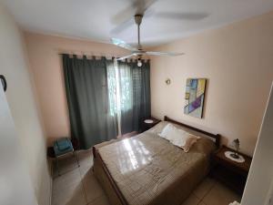 Una cama o camas en una habitación de Casa Barrio Cooperativo Villa Maria 6 fotos más