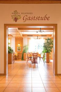 an entrance to a restaurant with a table and chairs at Gasthaus Kreuz in Ühlingen-Birkendorf