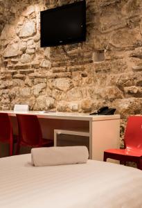 Televízia a/alebo spoločenská miestnosť v ubytovaní Slavija Culture Heritage Hotel