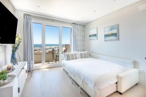 Postel nebo postele na pokoji v ubytování WintowinRentals Apartamento Suite en Ocean House + 37 fotografií