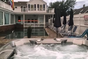 a hot tub in the backyard of a house at Captivating Cottage in Provincetown