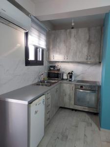 A kitchen or kitchenette at Apartment