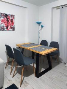 a wooden table and chairs in a room at Apartment in Ioannina