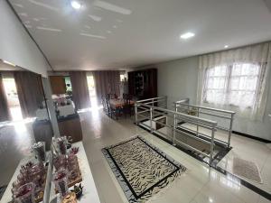 a large living room with a zebra rug on the floor at Guest House da Cris in Itabira