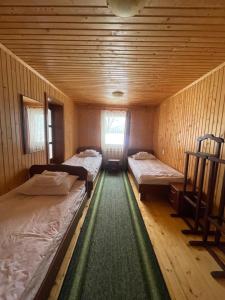 Postel nebo postele na pokoji v ubytování Made in Yaremche