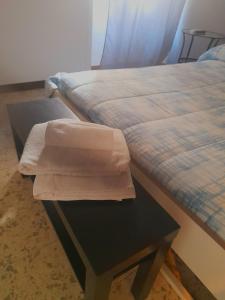 A bed or beds in a room at B&B RESTO AL SUD