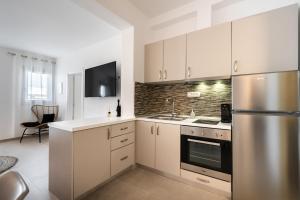 A kitchen or kitchenette at SN Santorini Apartments