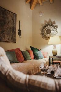 a living room with a couch and a mirror at Monte da Bela Raposa in Pavia