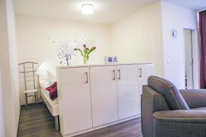 Posezení v ubytování Apartmenthaus Frauenpreiss FeWo 111 + 10 fotografií