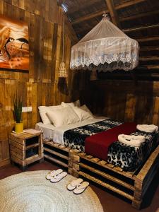 A bed or beds in a room at Serengeti Villa