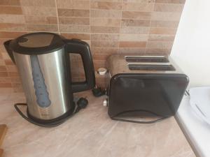 a toaster sitting on a counter next to a toaster oven at Daglas Seaside Studios in Nydri