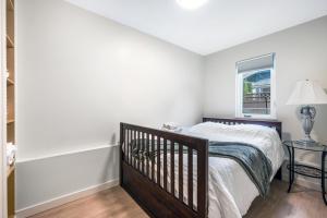 a bedroom with a bed and a window at Luxury Delta 2BD Suit on ground floor in Delta