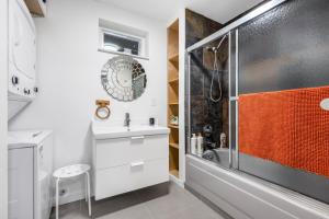 a bathroom with a shower and a sink at Luxury Delta 2BD Suit on ground floor in Delta +12 photos