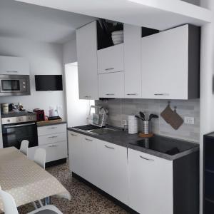 A kitchen or kitchenette at Appartamenti La Terrazza