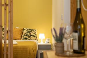 a bedroom with a bed and a lamp on a table at 731 Costa Cabral Metro Residence in Porto