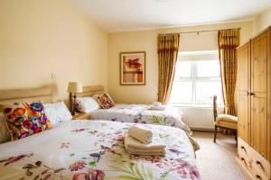 A bed or beds in a room at Lime Tree House