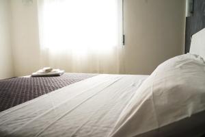 A bed or beds in a room at LA RESIDENZA DI ADAMO