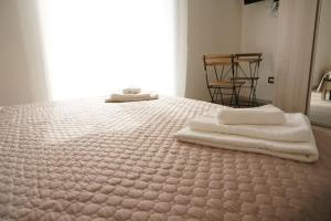 A bed or beds in a room at LA RESIDENZA DI ADAMO