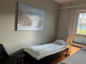 Ένα ή περισσότερα κρεβάτια σε δωμάτιο στο Tammela Apartments