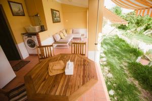 a living room with a table and a couch at 2Bedroom house with Swimming Pool and View in Moçarria