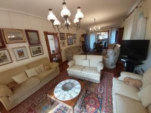 an aerial view of a living room with couches and a television at Villa Bice in Maresana in Ponteranica