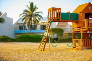 a playground on the beach in front of a house at دره العروس فيلا الاحلام للعائلات in Durat  Alarous