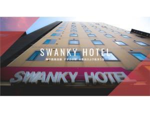 a tall building with the words snowy hotel on it at Swanky Hotel Otomo - Vacation STAY 99016v in Sapporo