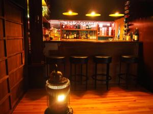 a bar with bar stools in a dark room at fumoku - Vacation STAY 12915v in Chino