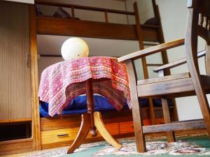 a chair with a blanket on top of a bunk bed at fumoku - Vacation STAY 12915v in Chino