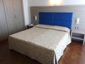 Postel nebo postele na pokoji v ubytování Grand Hotel Golf