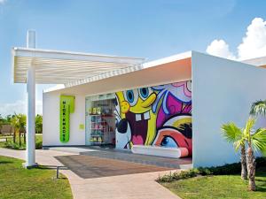 a store with a colorful mural on the side of it at Nickelodeon Hotels & Resorts Punta Cana - Gourmet All Inclusive by Karisma in Punta Cana