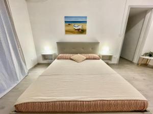 Postel nebo postele na pokoji v ubytování Bilocale Nel Centro Storico - Prossimo al Mare