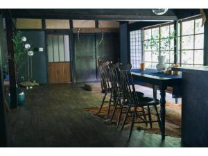 a dining room with a table and chairs at Hyogo private house yogoto - Vacation STAY 00235v in Kamikawa