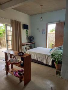 Postel nebo postele na pokoji v ubytování Mar de Arraial, Suites da Ju