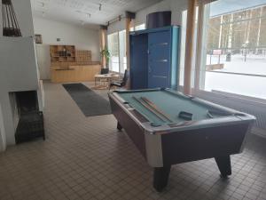 a room with a pool table in a room at Särkkä in Äänekoski