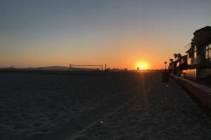 a sunset on the beach with a soccer goal at 5609 East Seaside Walk in Long Beach