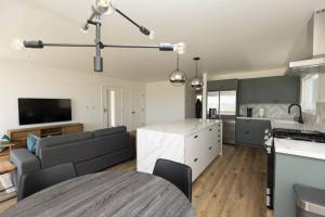 a kitchen and living room with a couch and a table at 5609 East Seaside Walk in Long Beach