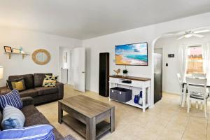 a living room with a couch and a table at 210 Forty Fourth Street in Newport Beach