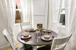 a dining room with a table and chairs and a window at 210 Forty Fourth Street in Newport Beach