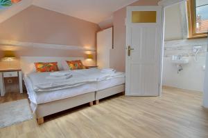 Postel nebo postele na pokoji v ubytování Gościniec Nowa Wioska + 69 fotografií