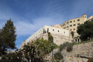 a building on top of a stone wall at Open Suite Cobalto in Cagliari