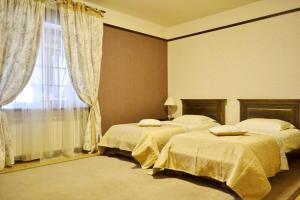 Säng eller sängar i ett rum på Gogol Hotel