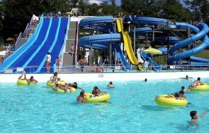 a group of people in the water at a water park at Milky's House in Isola del Cantone
