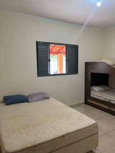 Postel nebo postele na pokoji v ubytování Chácara Toca do Oliveira + 22 fotografií