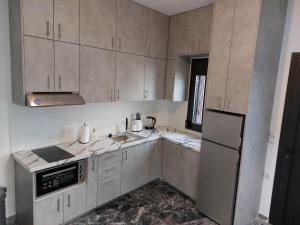 A kitchen or kitchenette at Helios Stays - Sisi Private Apartments